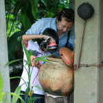 a-nurse-and-a-student-searching-for-dangerous-mosquito-larvae