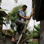 cleaning-the-drains-after-the-rainy-season-to-clear-out-all-water-puddles-to-protect-against-dengue-fever